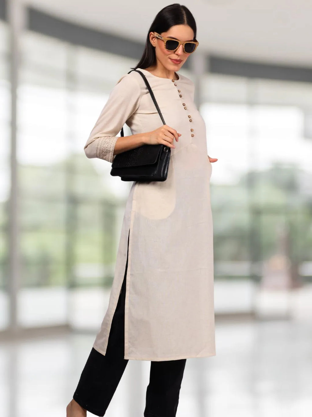 Off White Solid Cotton Kurta with Pockets & Sleeve Embroidery
