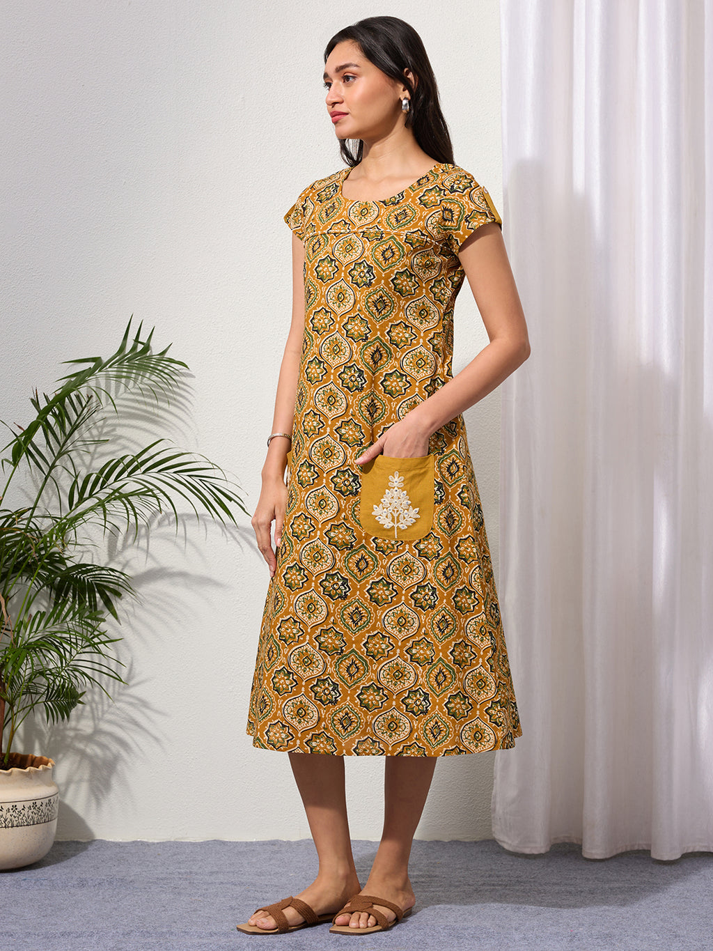 Mustard Ethnic Motifs Midi Dress with Embroidered Patch Pockets & Shoulder Tabs